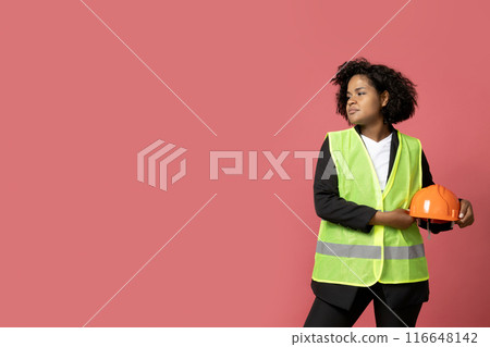 A young girl in the form of a construction worker with a hard hat 116648142