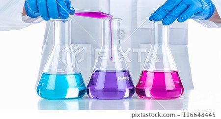 Three beakers filled with blue, purple, and pink liquids. 116648445