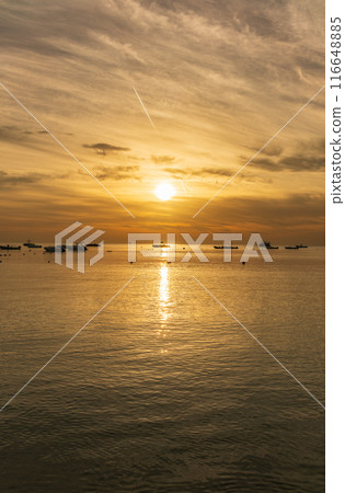 Beautiful red and orange sunrise over the sea. Beautiful red and orange sunrise over the sea. 116648885