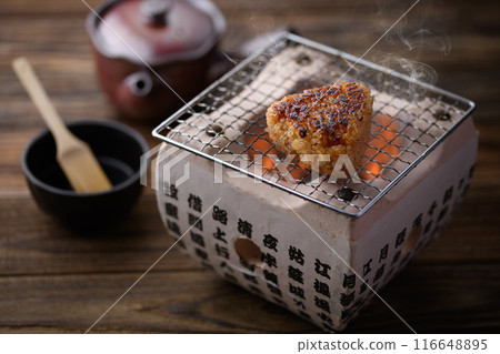 Make grilled rice balls on a charcoal grill Make grilled rice balls on a charcoal grill 116648895