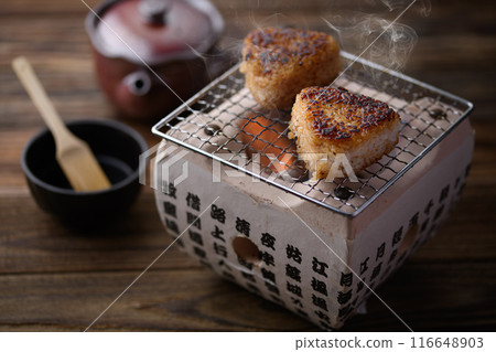 Make grilled rice balls on a charcoal grill Make grilled rice balls on a charcoal grill 116648903