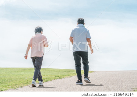 Elderly couple (senior, male and female) walking and aerobic exercise in the park Elderly couple (senior, male and female) walking and aerobic exercise in the park 116649114