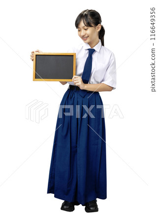 Portrait of an Asian Junior High School student girl in white and blue uniform standing while showing blank small blackboard Portrait of an Asian Junior High School student girl in white and blue uniform standing while showing blank small blackboard 116649356