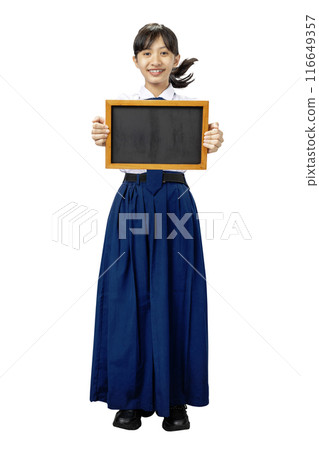 Portrait of an Asian Junior High School student girl in white and blue uniform standing while showing blank small blackboard Portrait of an Asian Junior High School student girl in white and blue uniform standing while showing blank small blackboard 116649357