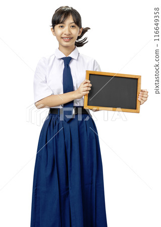 Portrait of an Asian Junior High School student girl in white and blue uniform standing while showing blank small blackboard Portrait of an Asian Junior High School student girl in white and blue uniform standing while showing blank small blackboard 116649358
