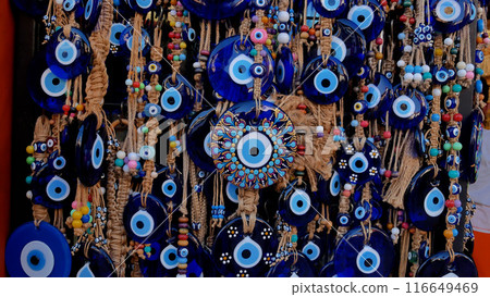 There are many amulets of the Turkish eye in the souvenir shop. 116649469
