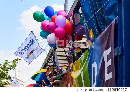 Colorful Pride Parade. Vibrant pride parade scene with balloons Colorful Pride Parade. Vibrant pride parade scene with balloons 116650317