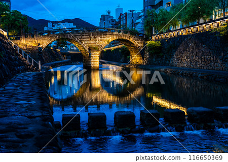 Illuminated night view of Nakajima River and Meganebashi Bridge [Nagasaki City] 116650369