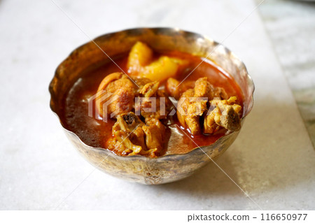 Cooked Chicken Served in metal bowl, Bengali Traditional Cooked Chicken Served in metal bowl, Bengali Traditional 116650977
