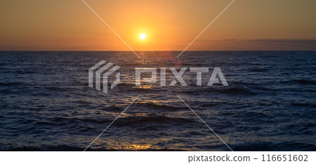Beautiful pink sunset over sea Beautiful pink sunset over sea 116651602