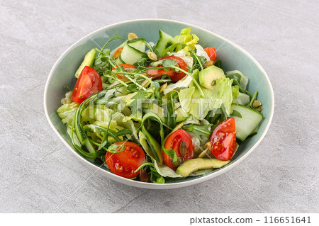 salad with tomatoes and cucumbers on a stone background, studio food photography 1 116651641