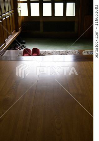 Sunlight shines through the step of an old house 116651683