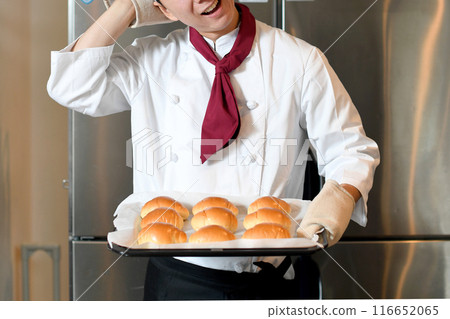 A worried young man making bread 116652065