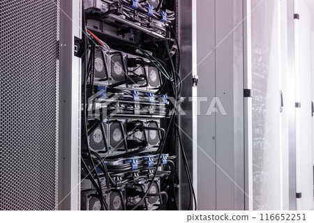 A row of racks with data storage hardware inside server room 116652251
