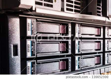 Row of hard drives serving as data storage inside server room Row of hard drives serving as data storage inside server room 116652300
