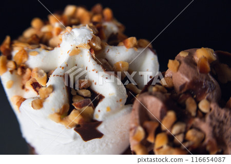 Two ice cream cones, one of cream and the other of chocolate Two ice cream cones, one of cream and the other of chocolate 116654087