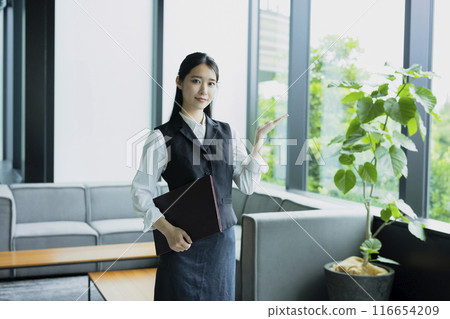 A woman giving a tour A woman giving a tour 116654209