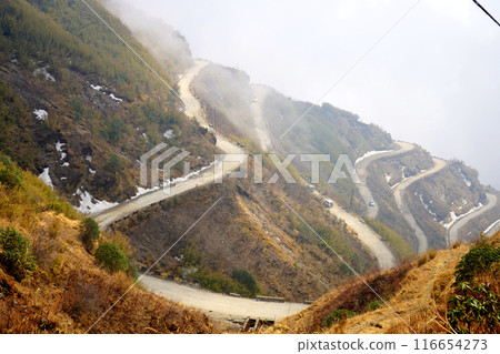 SNOW DEPOSITED BESIDE THE ROAD SIDE OF ZIG ZAG ROAD IN SILK ROUTE EAST SIKKIM SNOW DEPOSITED BESIDE THE ROAD SIDE OF ZIG ZAG ROAD IN SILK ROUTE EAST SIKKIM 116654273