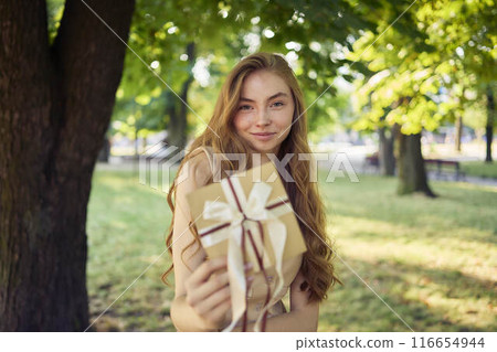 beautiful teenage girl in peach fuzz suit with vest, old money style with craft gift certificate beautiful teenage girl in peach fuzz suit with vest, old money style with craft gift certificate 116654944