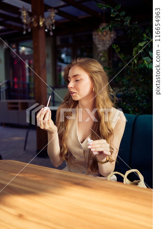 a  beautiful teenage girl in a peach fuzz suit with a vest, in the old money style in a fancy restaurant a  beautiful teenage girl in a peach fuzz suit with a vest, in the old money style in a fancy restaurant 116654963
