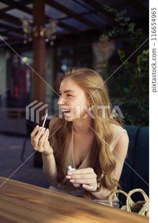 a beautiful teenage girl in a peach fuzz suit with a vest, in the old money style in a fancy restaurant a beautiful teenage girl in a peach fuzz suit with a vest, in the old money style in a fancy restaurant 116654965