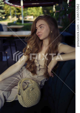 a beautiful teenage girl in a peach fuzz suit with a vest, in the old money style in a fancy restaurant a beautiful teenage girl in a peach fuzz suit with a vest, in the old money style in a fancy restaurant 116655062