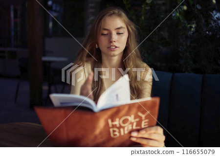 beautiful teenage girl in a peach fluffy suit with a waistcoat in the old money style reads the Holy Bible and prays beautiful teenage girl in a peach fluffy suit with a waistcoat in the old money style reads the Holy Bible and prays 116655079