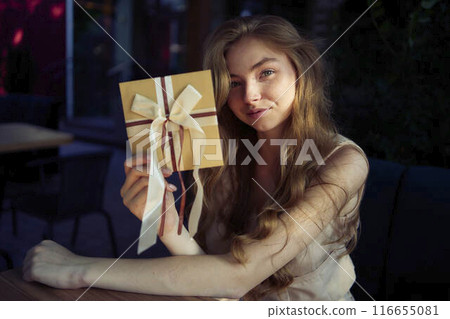 a beautiful teenage girl in peach fuzz suit with vest, old money style with craft gift certificate 116655081
