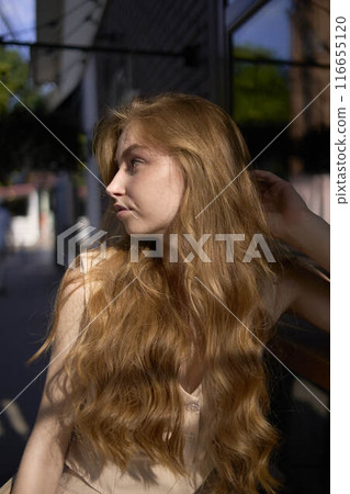 a beautiful teenage girl in a peach fuzz suit with a waistcoat in the old money style sits at the bar outside a beautiful teenage girl in a peach fuzz suit with a waistcoat in the old money style sits at the bar outside 116655120