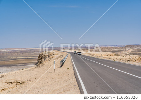 Ustyurt Plateau with car and Mangistau Ustyurt Plateau with car and Mangistau 116655326
