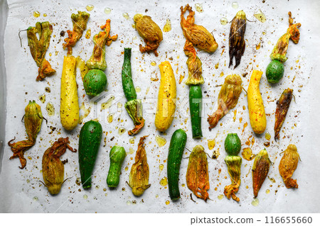 Baked different kind zucchini with flowers after baking in the baking oven 116655660
