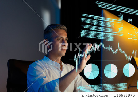 Businessman Analyzing Financial Data on Interactive Screen in Modern Office 116655979