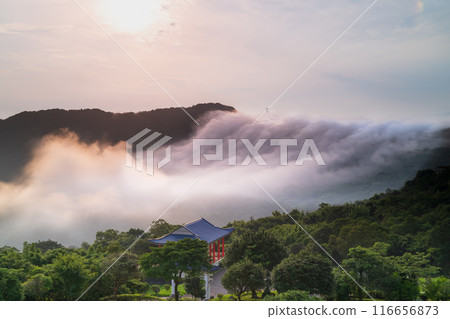 Sky colorful clouds. There is a cloud waterfall on the top of the mountain. 116656873