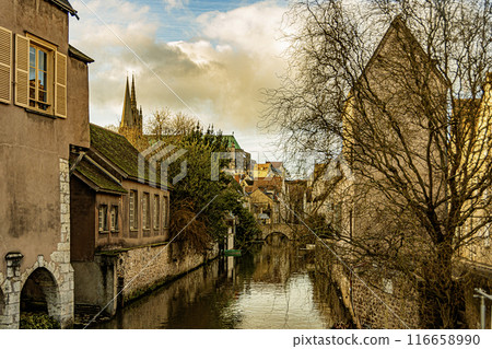The Eure River at Chartres and at background the domes of our lady basilica, France. 116658990