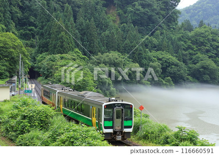 Tadami Line "Hayato Station and E120 series two-car train" with the river mist of the Tadami River in the background 116660591