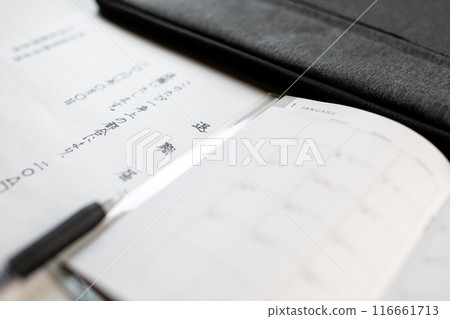 A handwritten resignation letter, a new schedule book and stationery A handwritten resignation letter, a new schedule book and stationery 116661713