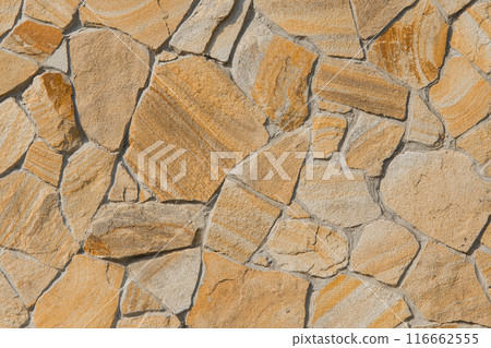 Rough brown stone texture abstract mosaic pattern floor wall rock background solid seamless structure backdrop coarse old 116662555