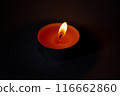 Candle on dark luxury night background. Black table, side view. Candles Burning at Night. Orange taper burning in focus, foreground. illustration design. 116662860