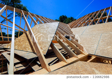 An construct wooden roofs beam from framework of trusses frames with rafters joists 116662986