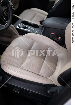 Before and after effect of cleaning leather upholstery in a car 116663069