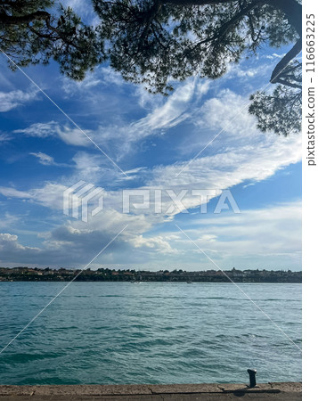 Stunning view over the Garda lake, seen from Peschiera del Garda. Beautiful summer day. 116663225