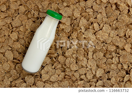 background of breakfast cereals with bottle of milk background of breakfast cereals with bottle of milk 116663732