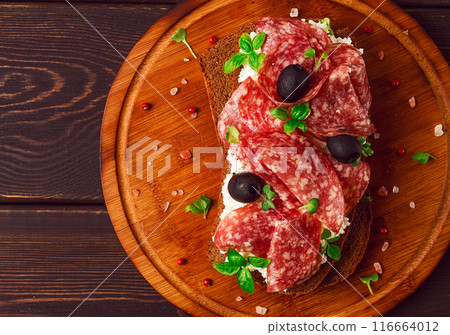 Sandwich , grain bread, with cream cheese and salami, black olives, micro-greens, top view, close-up, no people, Breakfast, 116664012