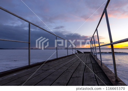Old pier is under sunset sky in the evening, perspective view Old pier is under sunset sky in the evening, perspective view 116665370