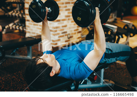 Man doing weight training at the gym 116665498