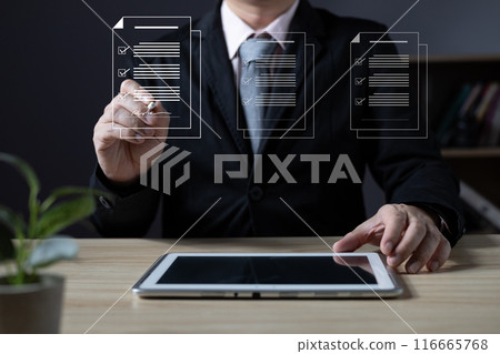 businessman sign digital documents online in the office, Document Management System (DMS), knowledge and documentation in enterprise with ERP, electronic signature. Paperless workplace concept. businessman sign digital documents online in the office, Document Management System (DMS), knowledge and documentation in enterprise with ERP, electronic signature. Paperless workplace concept. 116665768