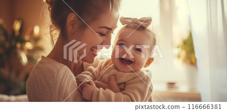 Heartwarming moment: joyful mother and baby bonding and smiling together 116666381