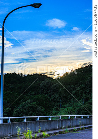 Street lights on the dam of Nunome Dam and the evening sky in the background. From before sunset through sunset to blue hour #18 116667435