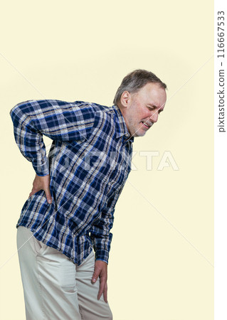 Mature senior caucasian man is having a back pain. Vertical shot white background. Mature senior caucasian man is having a back pain. Vertical shot white background. 116667533