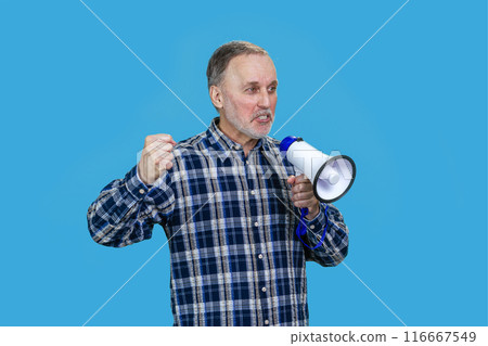 Portrait of aged mature man with megaphone. Isolated on blue. 116667549